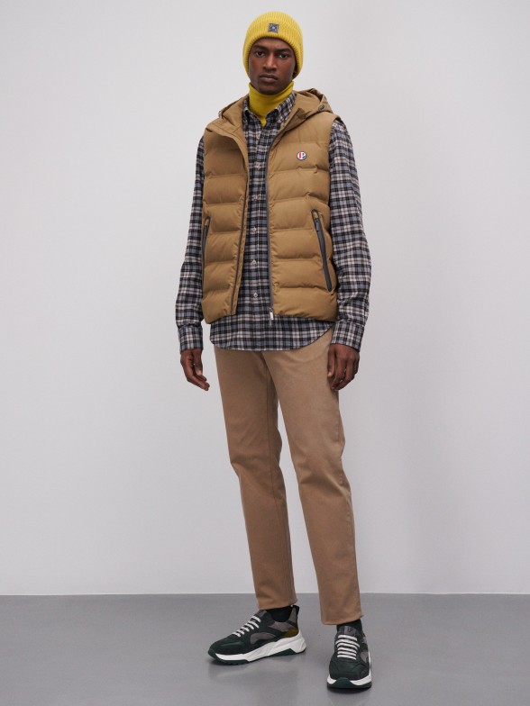 Man's padded waistcoat with hood and pockets