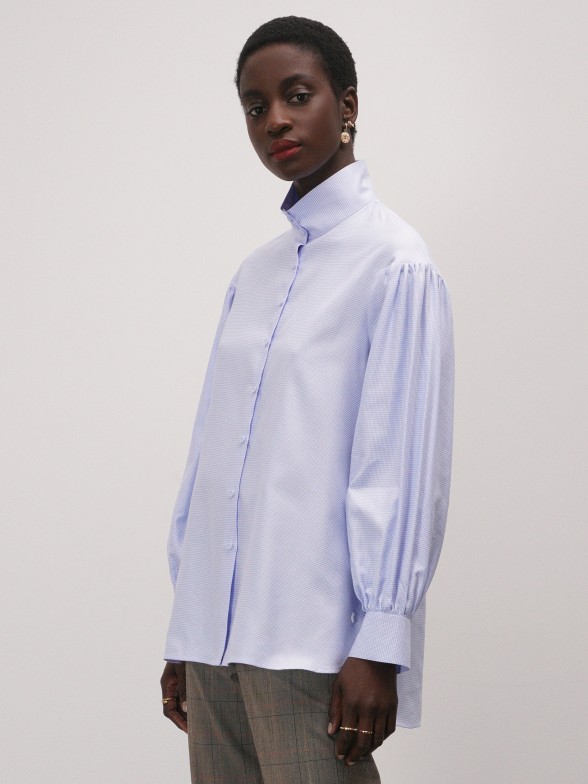 Asymmetric shirt with lined buttons