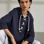 Woman's long cotton sweatshirt with embroidered eyelets