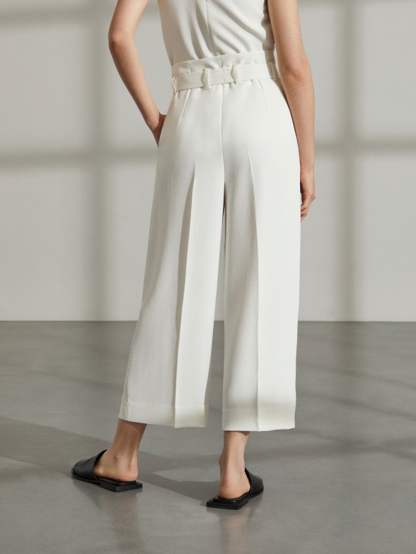 Woman's baggy paper bag trousers with belt