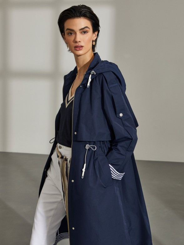Woman's navy blue jacket with stripe detail and hood