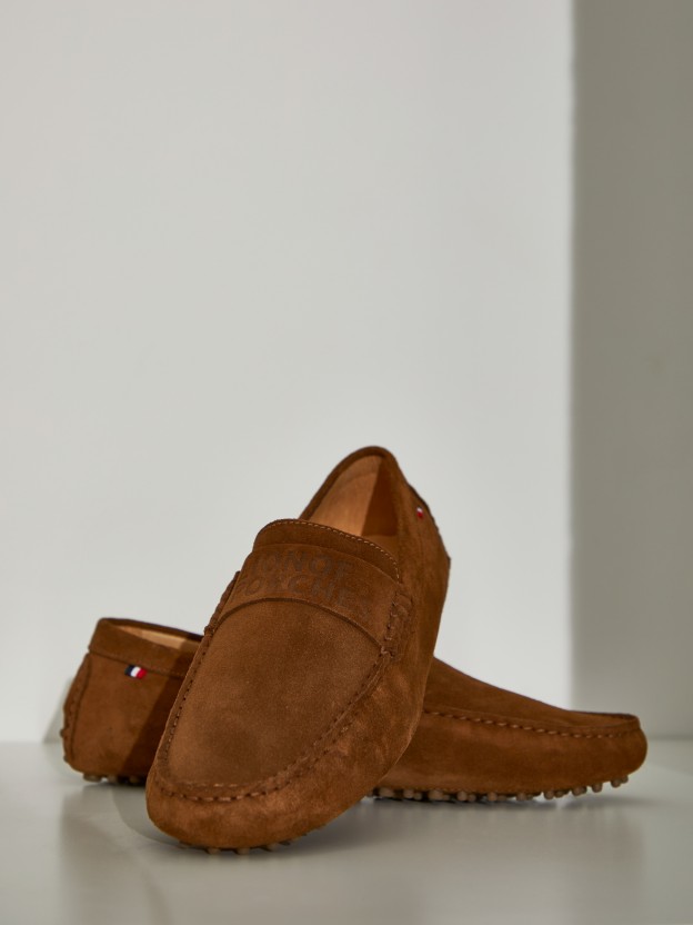 Man's classic shoes with rubber soles and branding