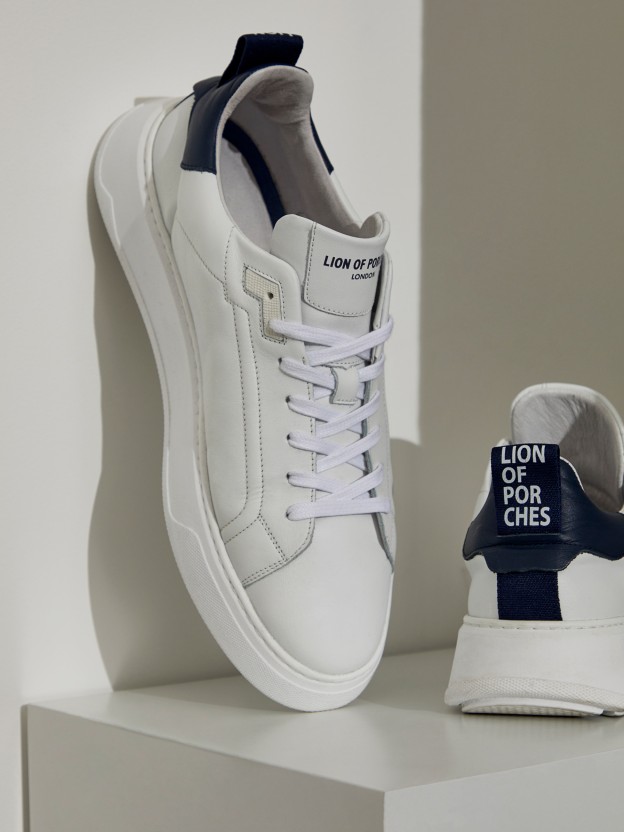 Man's white trainers with platform and blue details