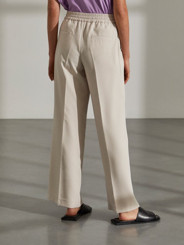 Woman's flowing trousers with elastic waistband and drawstring