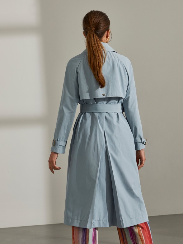 Woman's blue trench coat with belt
