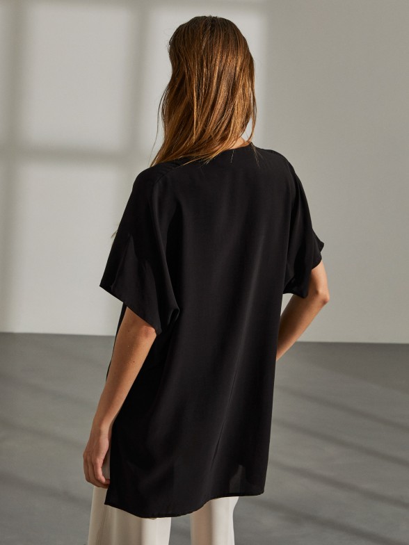 Woman's black asymmetric tunic with v-neck