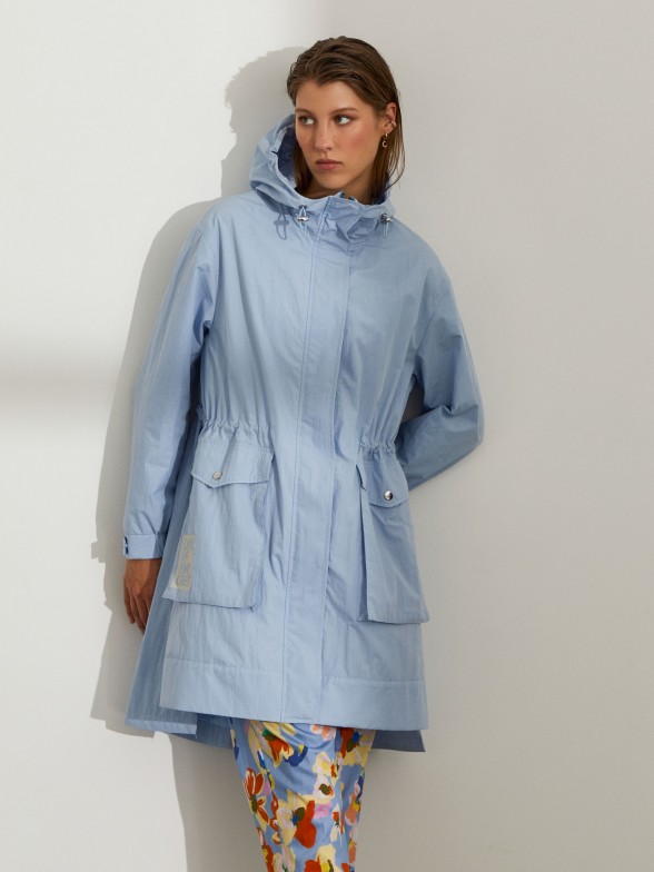 Woman's asymmetrical coat with hood and pockets