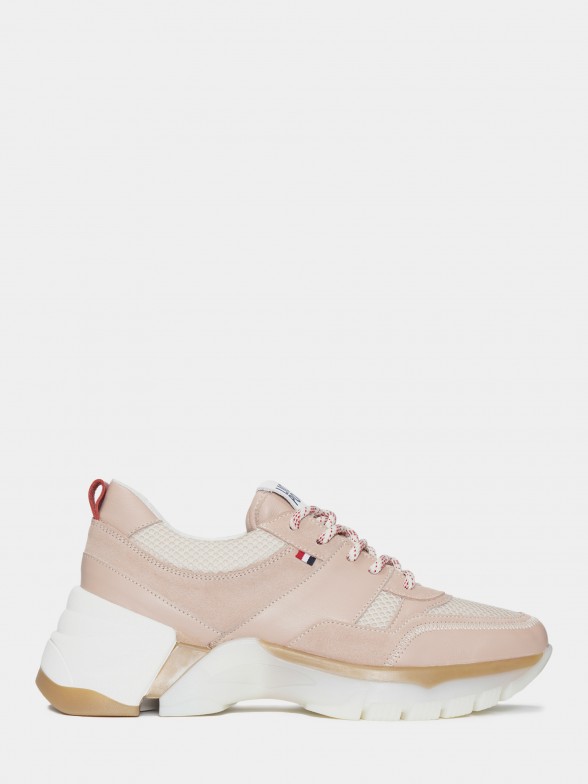 Woman's pink trainers with cut-out soles and laces