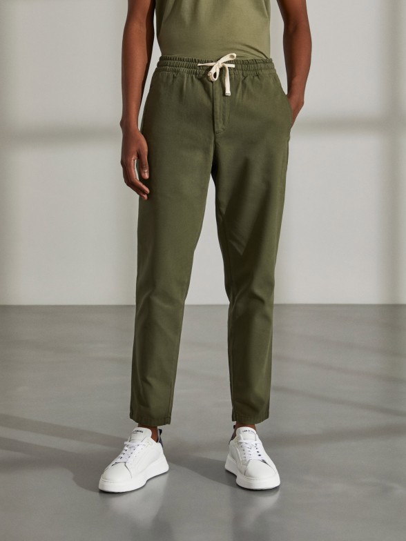 Man's regular fit trousers with drawstring and elastic waist