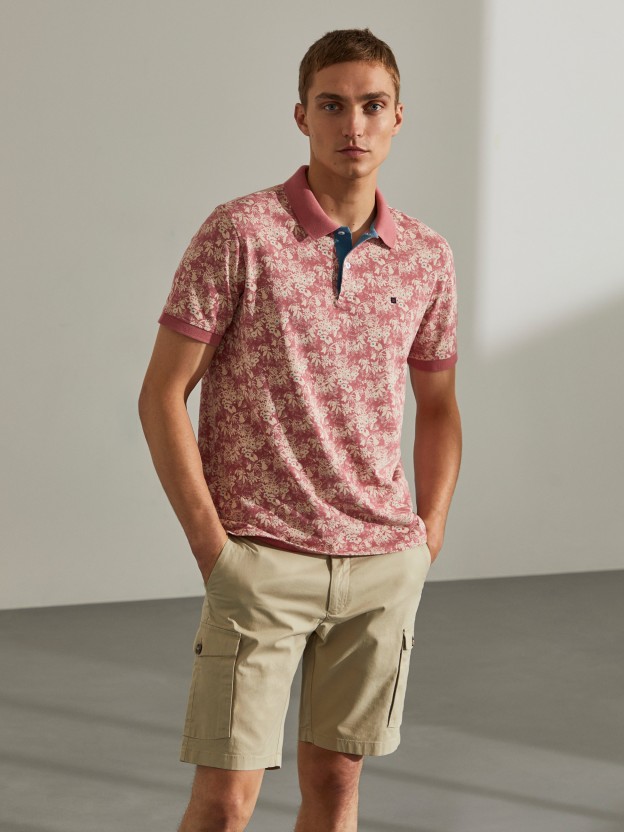 Man's regular fit polo shirt with flower pattern and short sleeves