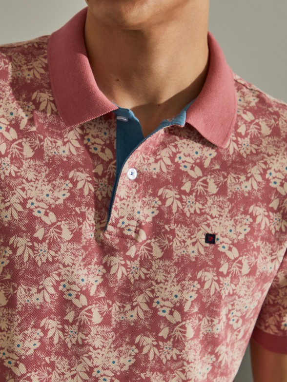 Man's regular fit polo shirt with flower pattern and short sleeves