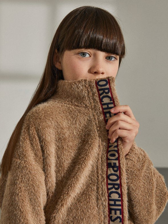 Fur coat with ribbon detail