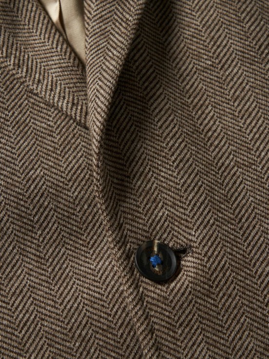 Man's slim fit blazer with herringbone pattern and pockets