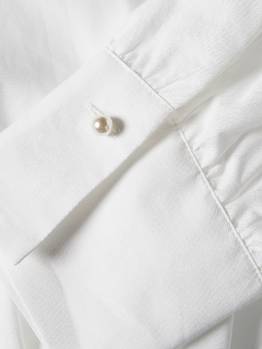 Shirt with pleats at the waist