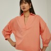 Shirt with flared sleeves