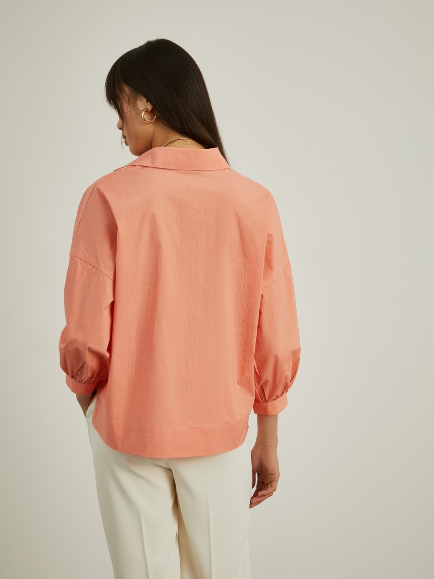 Shirt with flared sleeves