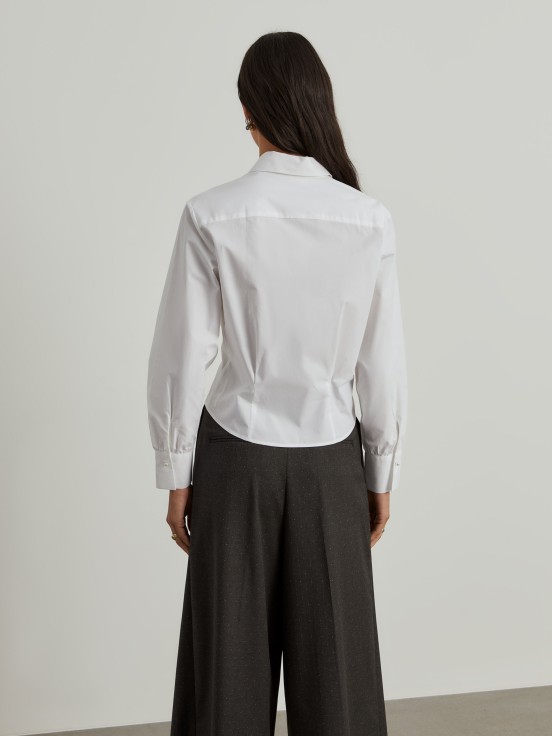 Shirt with pleats at the waist