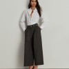 Shirt with pleats at the waist