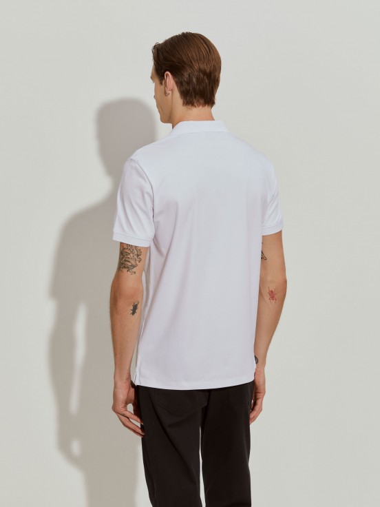Polo slim fit con muelles