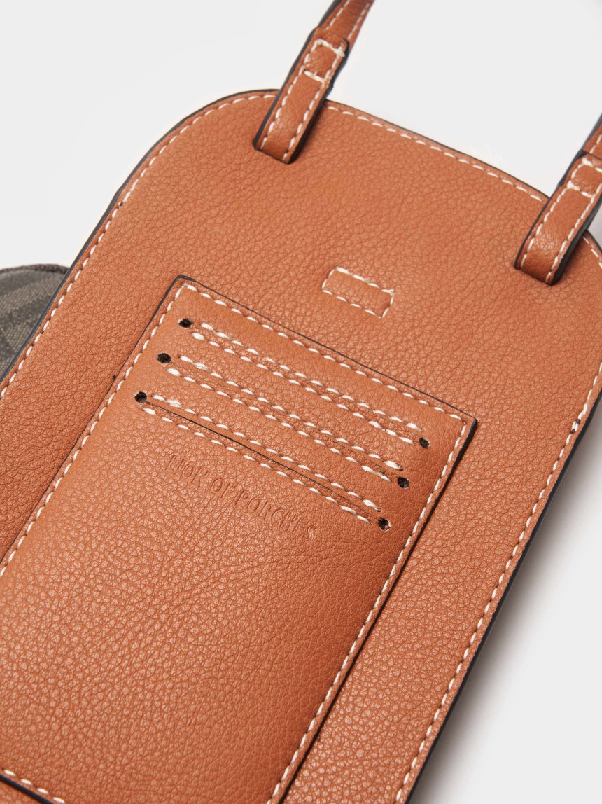 Cell phone holder with removable pouch