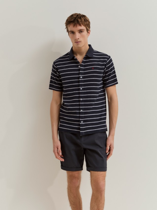 Polo camisa �s riscas