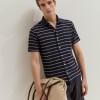 Polo camisa �s riscas