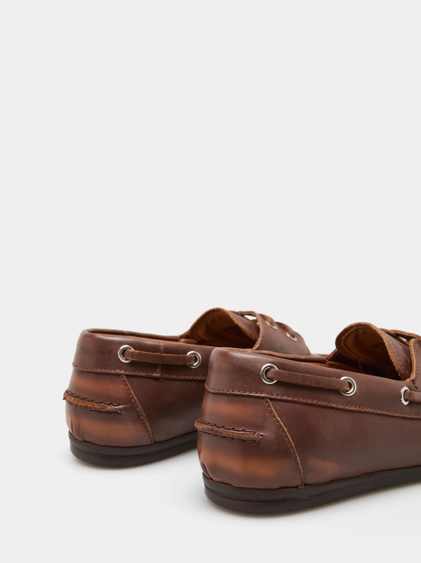 Sapatos de vela