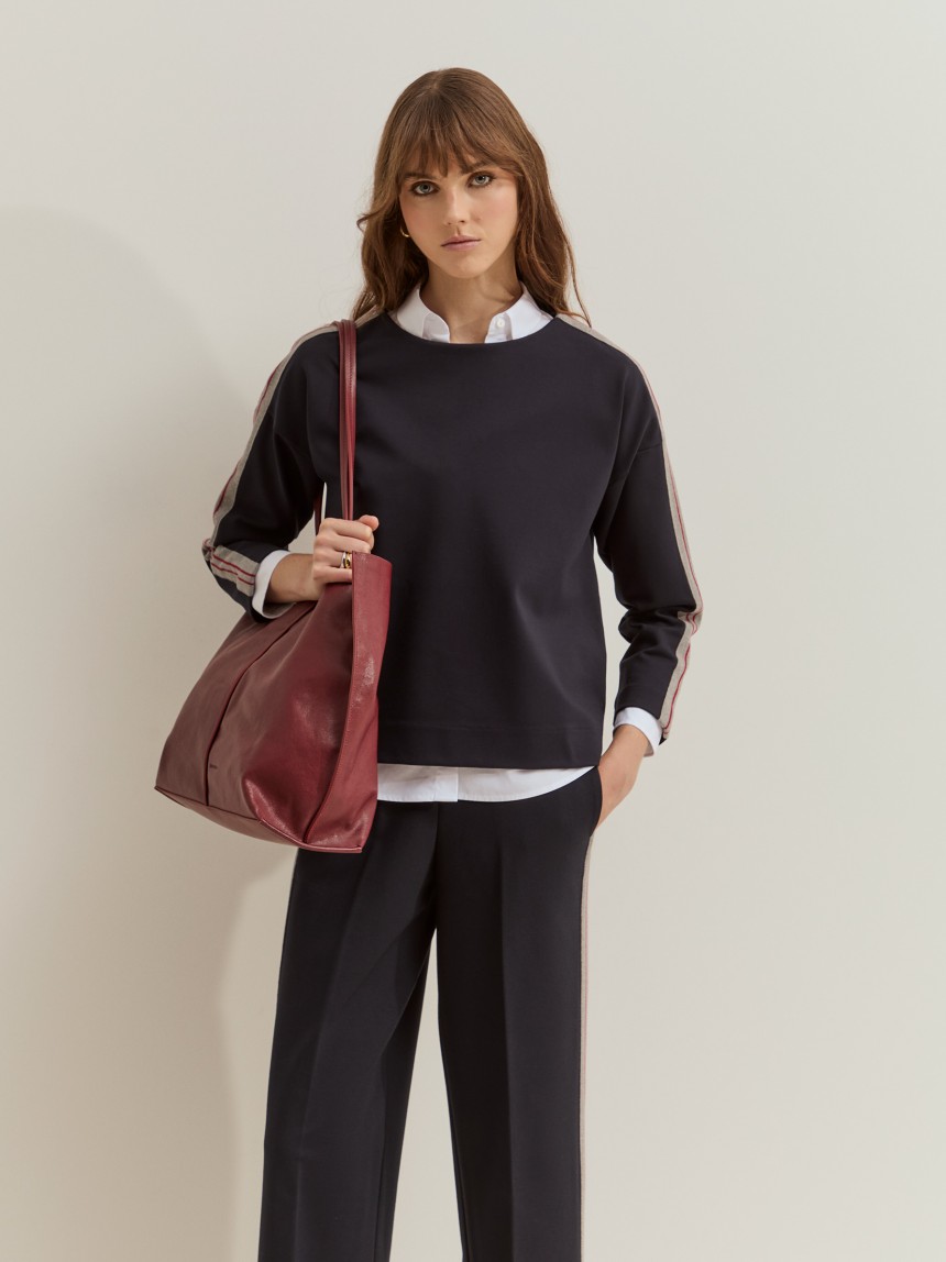 Knitted jumper with side panel