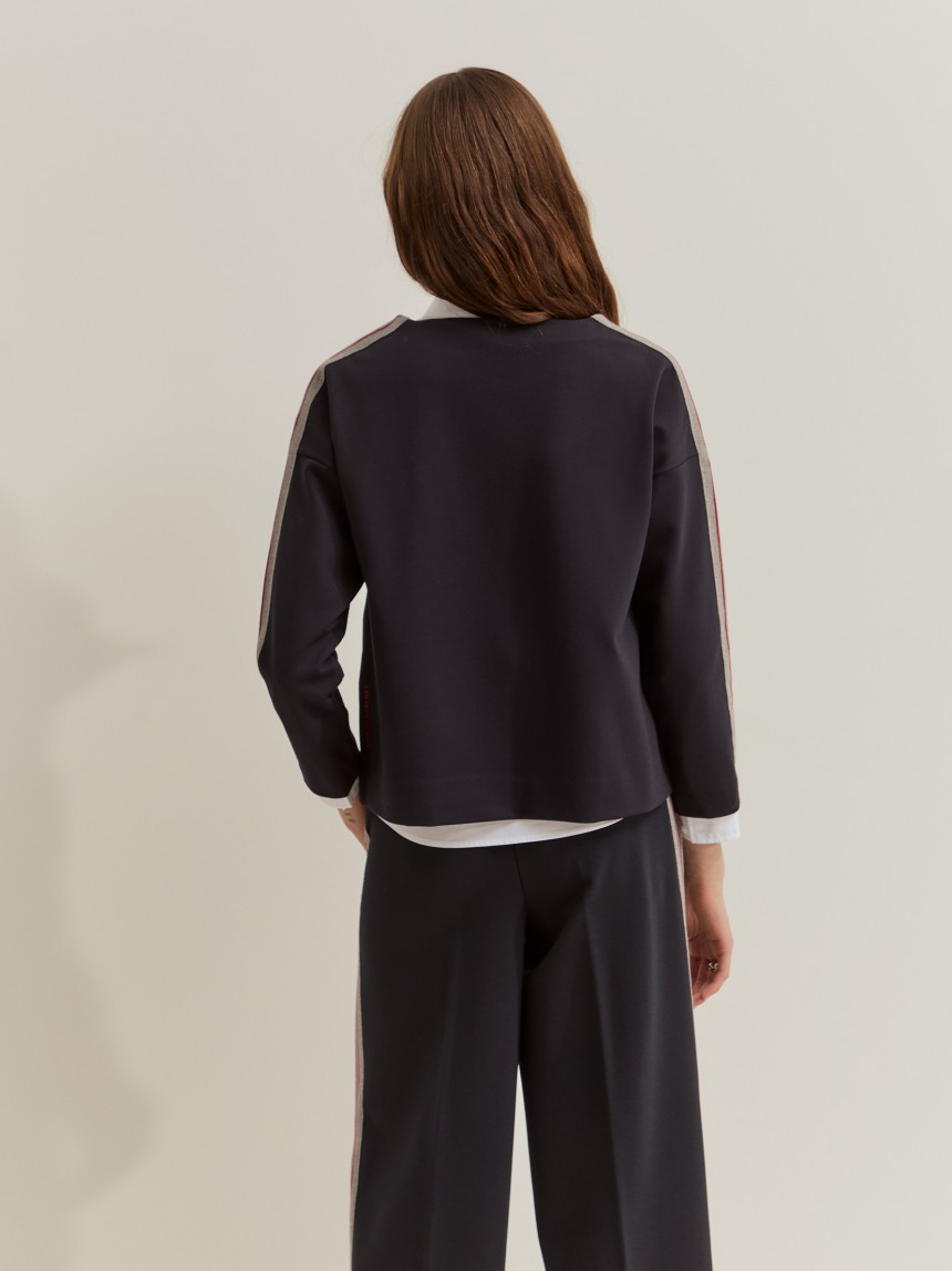 Knitted jumper with side panel