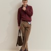 Knitted sweater with half-zip closure